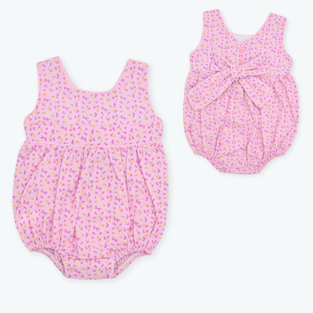 Asoleador Bebé Niña con Flores y Moño – Rosado